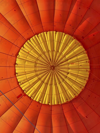 Hot air balloon inside view, top opens to release warm air before landing. Hot air balloon ride over the outback of Australia