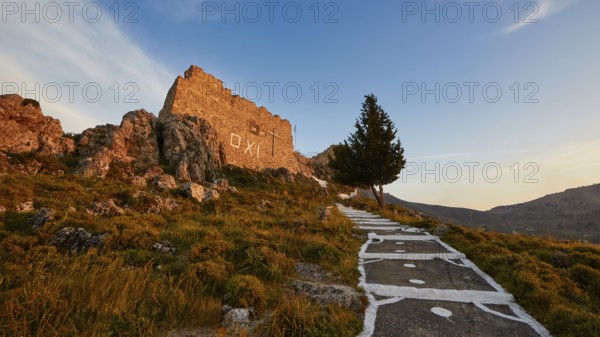 Warm evening light, path leading to a ruin with a single tree under a clear sky, Archangelos, castle, place, Castle of Archangelos, Rhodes, Dodecanese, Greek Islands, Greece, Europe