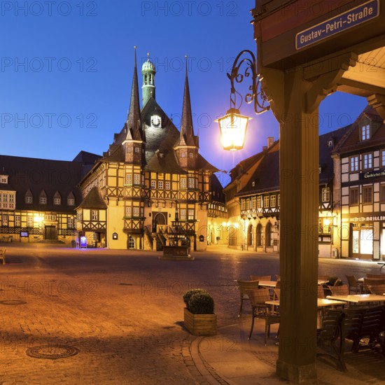 Market square with atmospherically illuminated town hall in the evening, Wernigerode, Harz, Saxony-Anhalt, Germany, Europe