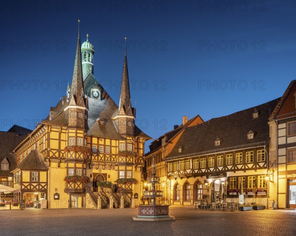 Market square, market fountain, historic town hall and half-timbered houses at dusk, Wernigerode, Harz Mountains, Saxony-Anhalt, Germany, Europe