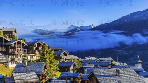 Roofs covered with hoarfrost, fog rising, Grimentz, Val d'Anniviers, Valais Alps, Canton Valais, Switzerland, Europe