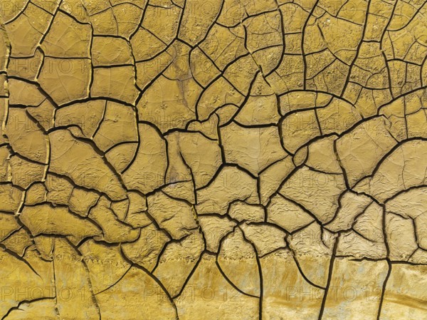 Mineral-rich cracked earth at the bank of the Rio Tinto (Red river), aerial view, drone shot, Huelva province, Andalusia, Spain, Europe