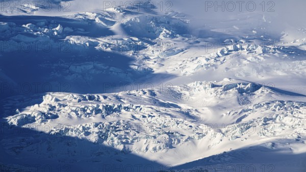 Light and shadow over the snow-covered glacier Oraefajökull, Sudurland, Iceland, Europe