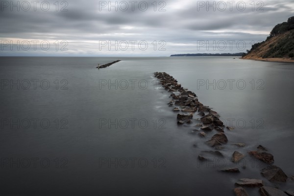 Coastal protection made of boulders, coastline on the Baltic Sea, dusk, long exposure, Baltic Sea resort Sellin, Rügen Island, Mecklenburg-Western Pomerania, Germany, Europe