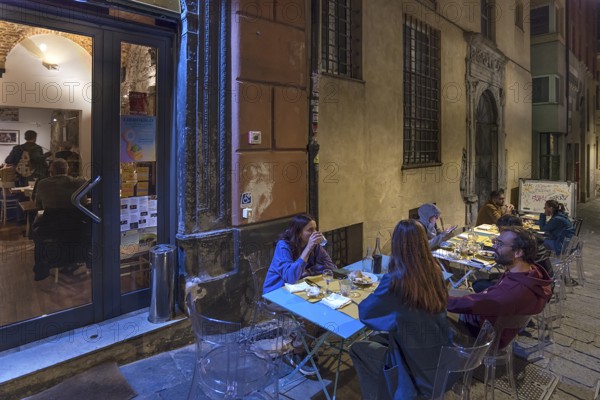 Guests sitting in the outdoor area of the Trattoria delle Grazie, Via delle Grazie, 48, Old Town, Genoa, Italy, Europe