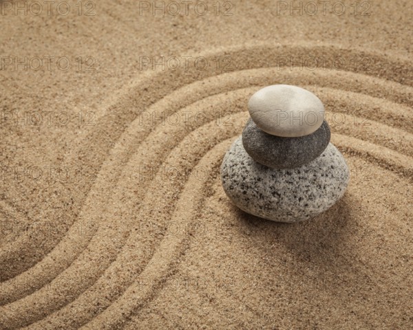 Japanese Zen stone garden, relaxation, meditation, simplicity and balance concept, pebbles and raked sand tranquil calm scene
