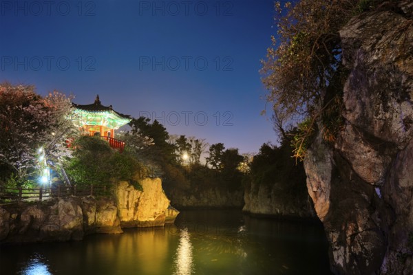 Scenic Yongyeon Pond with Yongyeon Pavilion illuminated at night, Jeju islands, South Korea, Asia