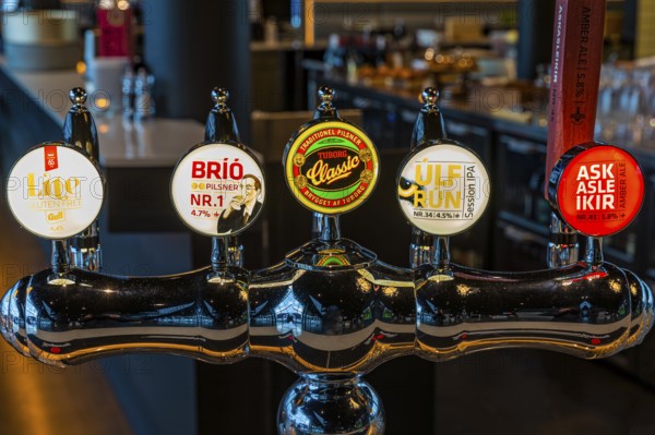 Illuminated beer tap at Hnoss Restaurant and Bar, Harpa Concert Hall and Congress Centre, Reykjavik, Reykjanes Peninsula, Sudurnes, Iceland, Europe