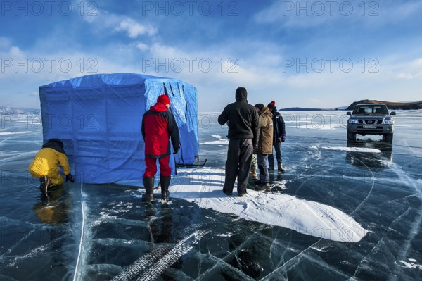 Group of scuba divers before a dive under ice, Lake Baikal, Olkhon Island, Pribaikalsky National Park, Irkutsk Province, Siberia, Russia, Europe