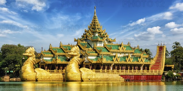 Panorama of Yangon icon landmark and tourist attraction: Karaweik, replica of a Burmese royal barge at Kandawgyi Lake, Yangon, Myanmar (Burma)