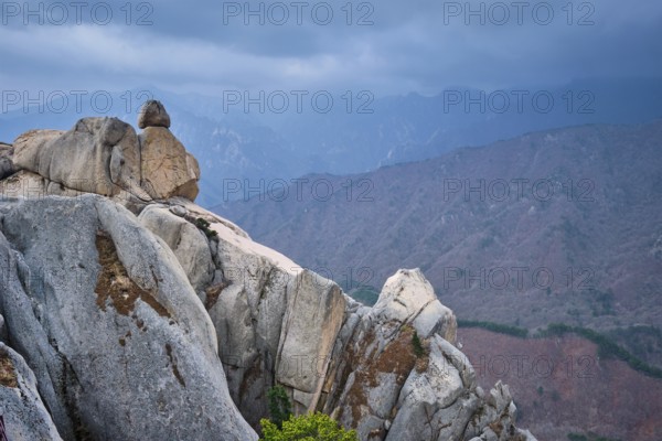 View of stone and rock formations from Ulsanbawi rock peak in stormy weather. Seoraksan National Park, South Corea