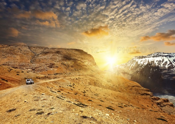 Road in mountains (Himalayas) with car. Spiti Valley, Himachal Pradesh, India, Asia