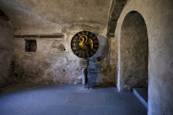 Interior photograph, historic Romanesque St John's disc, gold disc with eagle figure, treasure, golden, round, metal disc, crypt, Cathedral of Our Lady, Constance, Baden-Württemberg, Germany, Europe