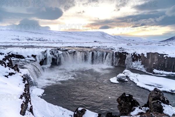 Beautiful landscape at Godafoss waterfall at sunset in winter, Iceland, Europe