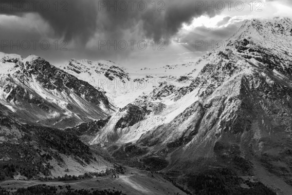 Dark clouds over the snow-covered mountains, black and white photo, above Saint Luc, Val d'Anniviers, Valais Alps, Canton Valais, Switzerland, Europe