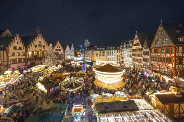 The carousel on the Römerberg turns. The Frankfurt Christmas Market was officially opened on 25 November 2024 when the lights on the Florian Christmas tree, a 26-metre-high spruce from Lower Franconia, were switched on. The Christmas market will be open until 22 December from Monday to Saturday from 10:00 am to 9:00 pm and on Sundays from 11:00 am to 9:00 pm. Frankfurt am Main, Römerberg, Hesse, Germany, Europe