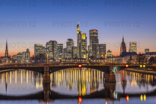 The lights of Frankfurt's banking skyline glow in the evening after sunset, Frankfurt am Main, Hesse, Germany, Europe