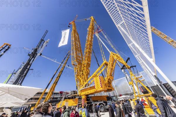 BAUMA Munich, 34th World's Leading Trade Fair for Construction Machinery, Building Material Machines, Mining Machines, Construction Vehicles and Construction Equipment. BAUMA is the world's largest trade fair in terms of exhibition space. LG 1800-1.0 lattice boom crane from the German manufacturer Liebherr with a maximum lifting height of 204 metres. Munich, Bavaria, Germany, Europe