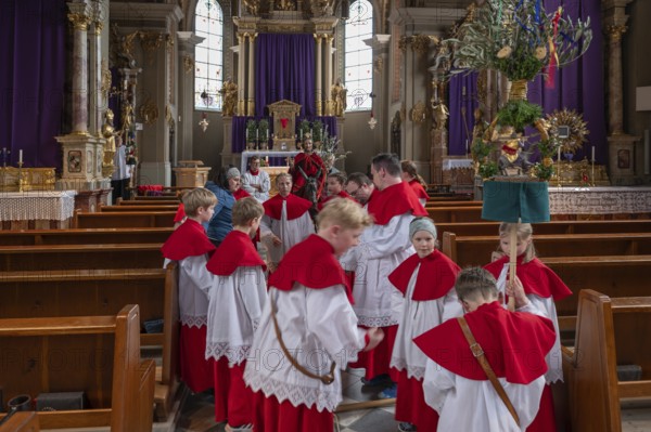 Altar servers preparing for the palm tree procession, tradition since the 18th century, Parish Church of the Assumption of the Virgin Mary, Thaur, Innsbruck district, Tyrol, Austria, Europe