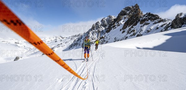 Ski tourer with rope, rope team on the Vadret da Porchabella glacier on the ascent to the summit of Piz Kesch, mountain landscape in winter, alpine tour, ski tour Bündner Haute Route, Albula Alps, Rhaetian Alps, Grisons, Eastern Switzerland, Switzerland, Europe