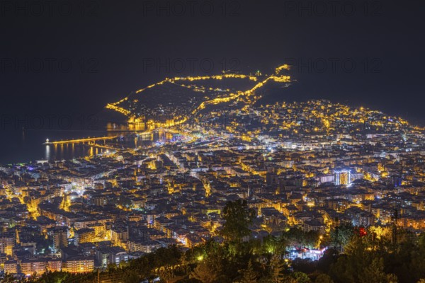 The lights of the city of Alanya on the Turkish Riviera glow in the evening, Alanya, Antalya, Turkey, Asia