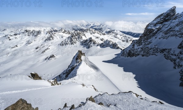 Mountain ridge of Piz Kesch, ascent on Piz Kesch or Piz d'Es-cha in winter, spectacular mountain landscape, view of mountain panorama with glacier Vadret da Porchabella, Albula Alps, Rhaetian Alps, Grisons, Eastern Switzerland, Switzerland, Europe