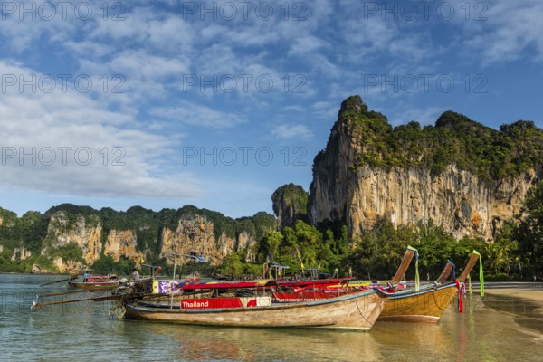 Island landscape near Krabi, weather, sky, nature, beach, beach holiday, beach holiday, Asian, limestone, limestone rocks, longtail boat, wooden boat, fishing boat, water taxi, tourist boat, sea, island, seascape, travel, tourism, seascape, climate, tropical, holiday, beach landscape, chalk cliffs, exotic, bay, bay of the sea, rock, rocky, sandstone cliffs, coast, coastal landscape, landscape, nature, natural landscape, Siam, paradise, holiday paradise, seascape, Railay beach, Phuket, Thailand, Asia