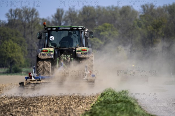 A tractor works a field, due to long dryness in spring, no rain for more than 4 weeks, the fields are dusty, south of Straelen, Lower Rhine, North Rhine-Westphalia, Germany, Europe