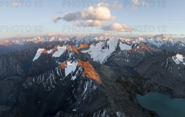 Evening mood, mountain panorama, aerial view, 4000 metre peak with glacier, mountain pass and mountain lake Ala-Kul Lake, Tien Shan, Kyrgyzstan, Asia