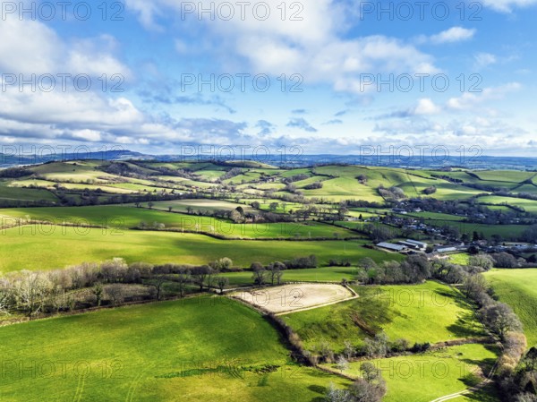 Farms over Morcombelake Village from a drone, Bridport, Dorset, England, United Kingdom, Europe