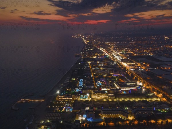 The lights of the tourist accommodations on the Turkish Riviera near Alanya glow colourfully in the evening after sunset, Alanya, Antalya, Turkey, Asia