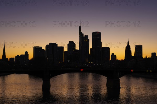 The silhouette of Frankfurt's banking skyline stands out in the evening against the residual light of the setting sun, Frankfurt am Main, Hesse, Germany, Europe