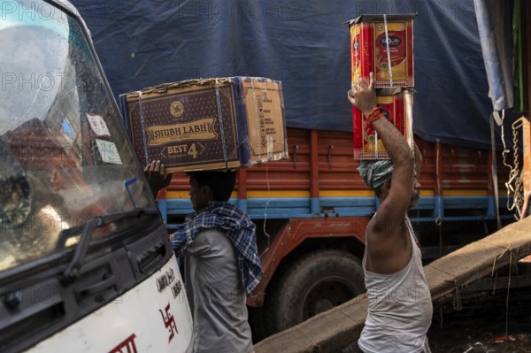 GUWAHATI, INDIA - MAY 1: Labourers carries goods in a wholesale market, in Guwahati, India, on May 1, 2025. May Day or Workers Day is a global holiday celebrated on May 1st to honor workers and their contributions, Asia