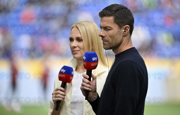 Coach Xabi Alonso Bayer 04 Leverkusen, in interview, microphone, mike, logo, SKY, sports presenter Britta Hofmann, PreZero Arena, Sinsheim, Baden-Württemberg, Germany, Europe