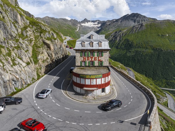 Hotel Belvédère on the Furka Pass, the most famous pass hotel in the world. The building is closed and falling into disrepair. A lost place. Drone photo. Obergoms, Canton Valais, Switzerland, Europe