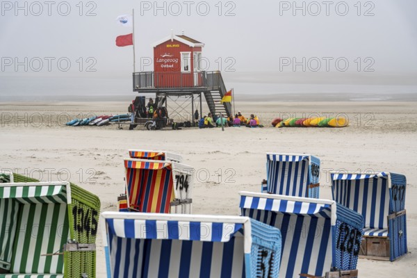 North Sea island Langeoog, early summer, shortly after the first easing of the lockdown in the Corona crisis, foggy weather, still quite few tourists on the beach, beach chairs, Lower Saxony, Germany, Europe
