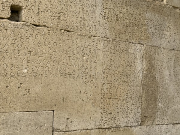 Detailed view of sandstone blocks Stones made of sandstone with written laws carved into the wall of the archway behind the amphitheatre City law of Gortys carved in stone Gortyn law book Large inscription, written in Doric dialect alternately from left to right and right to left, oldest discovered legal text in Europe, Gortyna, Crete, Greece, Europe