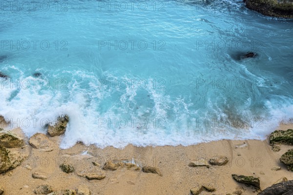 Beach in the Blue Lagoon bay on the holiday island of Nusa Lembongan, blue, algae formation, bright, turquoise, surf, surf, summer, natural spectacle, attraction, beautiful, long-distance travel, exotic, holiday idyll, paradise, paradisiacal, holiday paradise, rock, rocky, rocky coast, bathing bay, bay, coastal landscape, tropical, water, sea, ocean, coast, travel, holiday, tourism, sea view, seascape, Asian, Bali, Indonesia, Asia