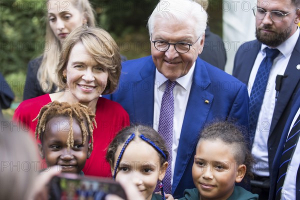 Elke Büdenbender (woman of the Federal President) and Frank-Walter Steinmeier (President of the Federal Republic of Germany) have their photo taken with children from the partner country Kenya at the Federal President's Citizens' Festival in Bellevue Palace Gardens, Berlin, 14/09/2024