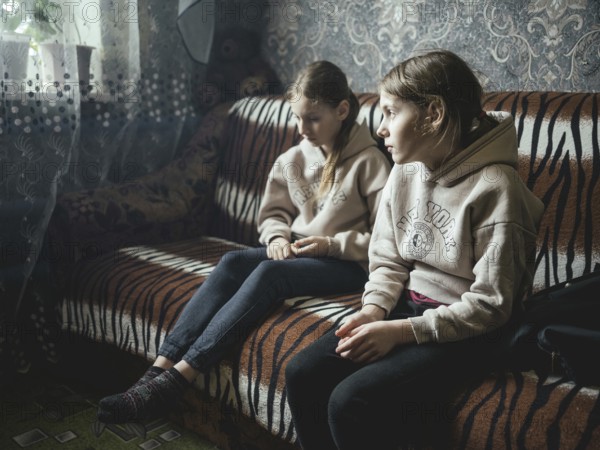 Sveta and Ira in their family home in Voloska Balakliia. The village is close to the front line, artillery fire can be heard every day, Voloska Balakliia, Kharkiv Oblast, Ukraine, Europe