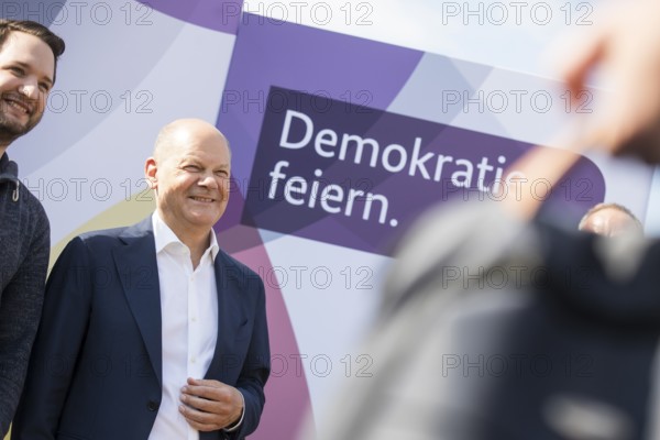 Olaf Scholz (Federal Chancellor, SPD) has his photo taken with visitors after a tour of the Citizens' Festival Celebrating Democracy. / The Basic Law turns 75, together it will be a celebration, Berlin, 24.05.2024