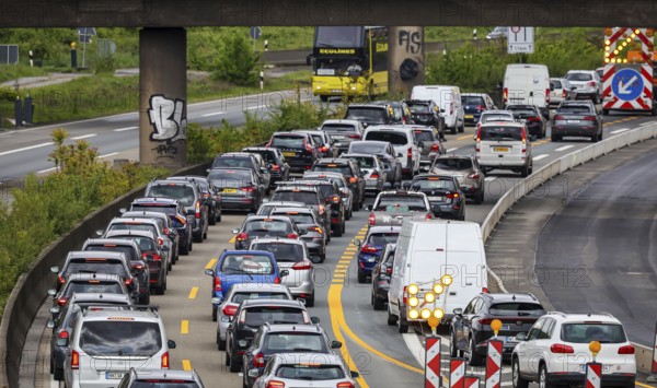 Duisburg, North Rhine-Westphalia, Germany, traffic jam on the A40 motorway at the Kaiserberg junction. The busy area with the A40 and A3 motorways has been undergoing renovation and expansion for years. There are always closures or restrictions for motorists there, Europe