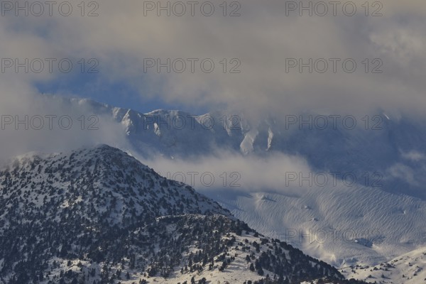 Snow-covered mountain peaks under a slightly cloudy sky, Lefka Ori, White Mountains, mountain massif, west, Crete, Greece, Europe