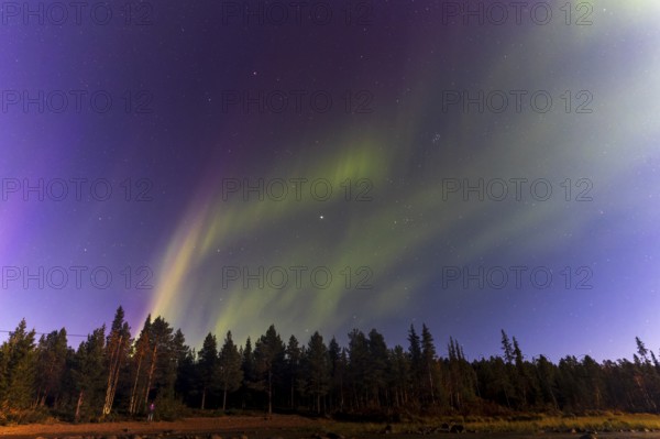 Northern lights, (Aurora borealis) at a lake near Kiruna, September 2024, Lapland, Sweden, Europe