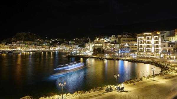 Harbour at night with illuminated buildings, lights reflected in the calm water, Pigadia, town and harbour, Pigadia Bay, main town, Karpathos, Dodecanese, Greek Islands, Greece, Europe
