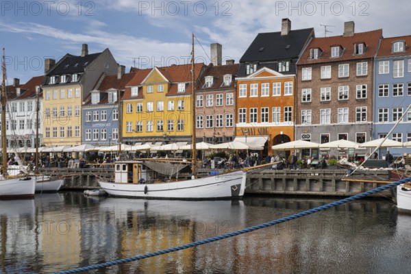 Nyhavn, in the Frederiksstaden district, harbour district with houses over 300 years old, moored sailing boats, promenade with many cafés, pubs, restaurants, canal, tourist attraction, Copenhagen, Denmark, Europe