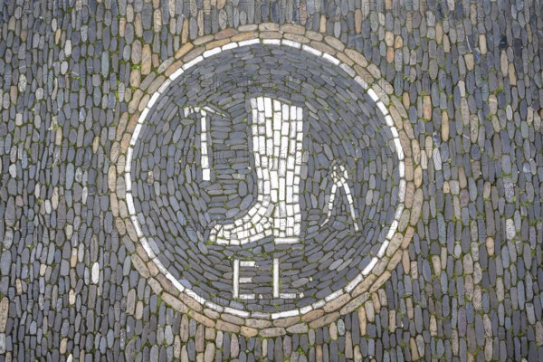 Guild coat of arms of a shoemaker as a floor mosaic in the historic centre of Freiburg, Freiburg im Breisgau, Baden-Württemberg, Germany, Europe
