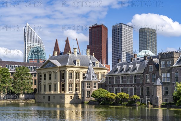 The Mauritshuis, historical art museum at the Binnenhof, seat of the Dutch government, Hofvijver pond, skyline of the city centre at the central station, in the city centre of The Hague, Netherlands