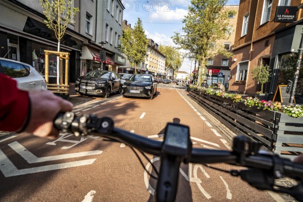 Cycling in the city, city centre road, cycle lane, two-wheeled traffic has priority, 30 km/h zone, cyclists' perspective, Essen, North Rhine-Westphalia, Germany, Europe
