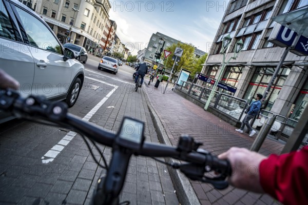 Cycling in the city, city centre road, cycle lane, bikes have right of way, 30 km/h zone, traffic in both directions, cyclists' perspective, Essen, North Rhine-Westphalia, Germany, Europe